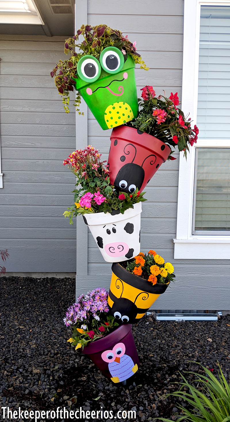 15 Amazing Flower Tower and Tipsy Pot Planters You Can Build- These DIY flower towers and tipsy pot planters are stunning ways to add vertical interest to your garden, porch, or front entry! | #tipsyPot #flowerTower #DIY #gardening #ACultivatedNest